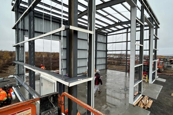 Metal structure under construction at building site.